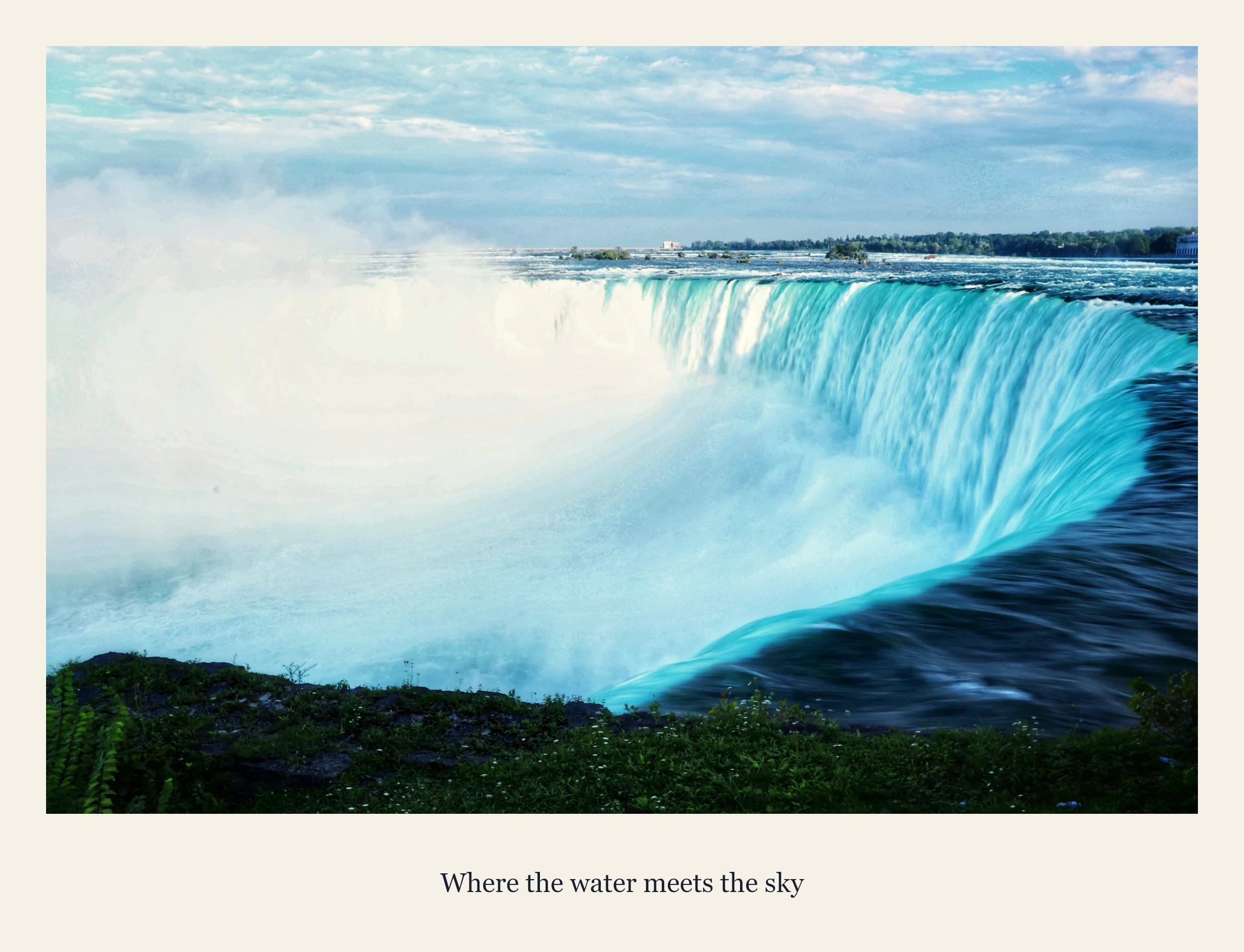 A warm photograph of the falls in an ivory captioned frame